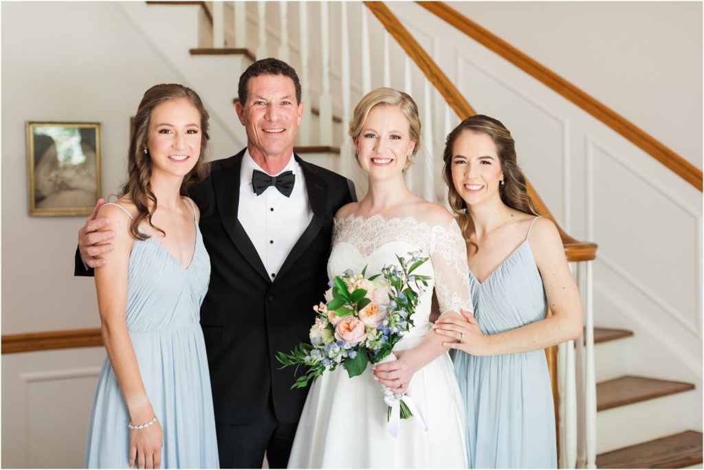 father of the bride with his three daughters on brides wedding day