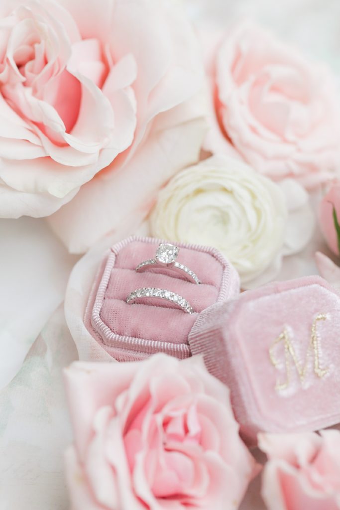 monogrammed blush ring box with gorgeous bridal flowers surrounding the rings