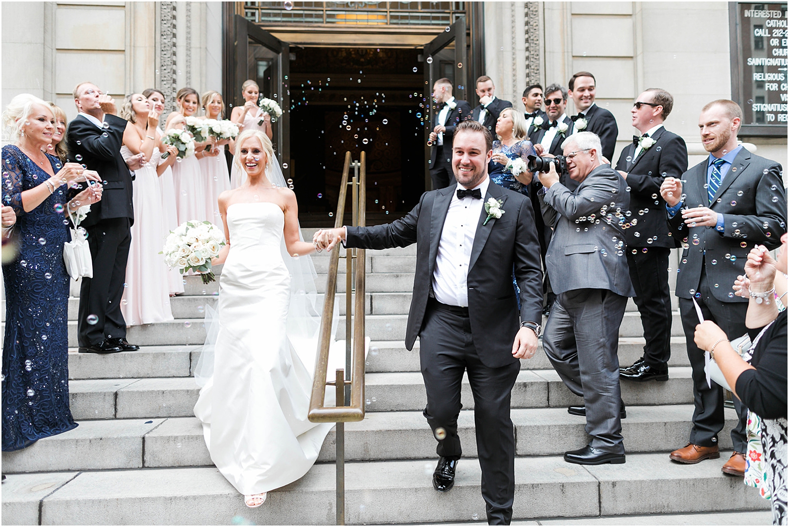 bride and groom exit church of st ignatius loyola wedding in new york
