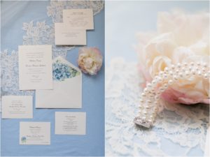 baby blue and white invitation suite on wedding day