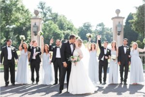 bridal party pictures celebrate with bride and groom on wedding day