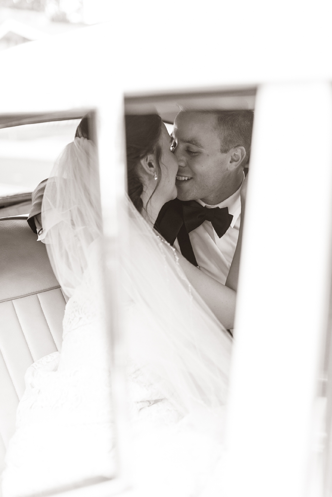 black and white classic wedding photo of bride and groom sharing a kiss in Newark, NJ wedding