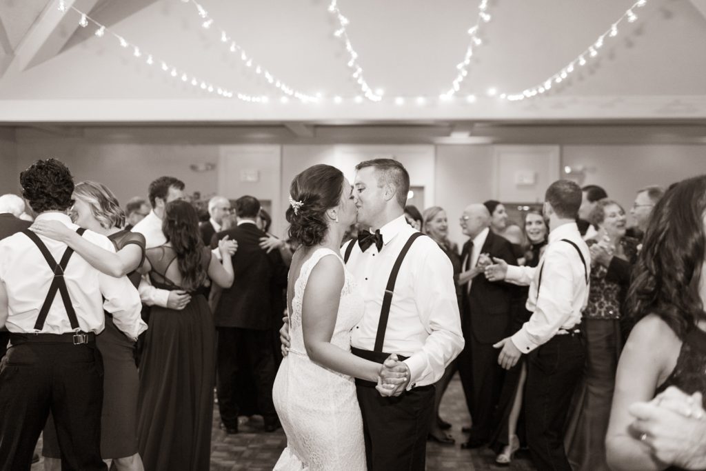 Bride and Groom share a kiss at their wedding reception in Newark, NJ