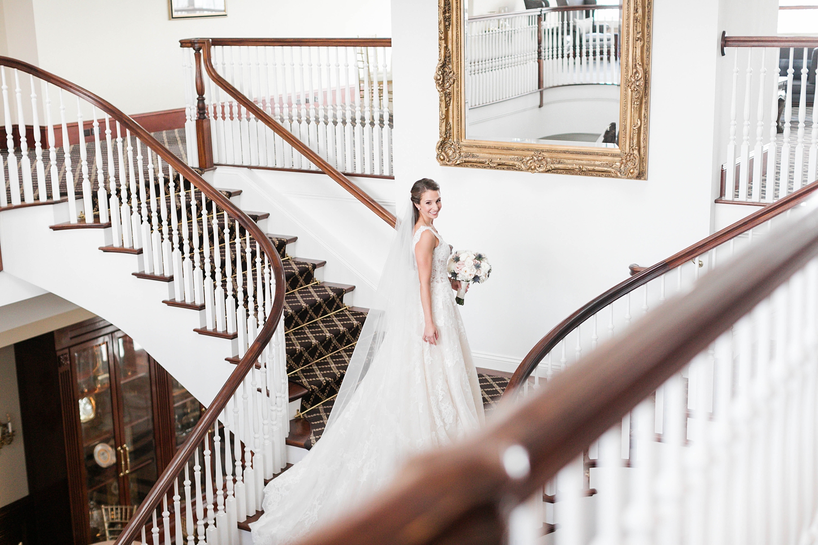 gorgeous bridal shot in front of giant gold mirror at the Trump National Golf Club Westchester