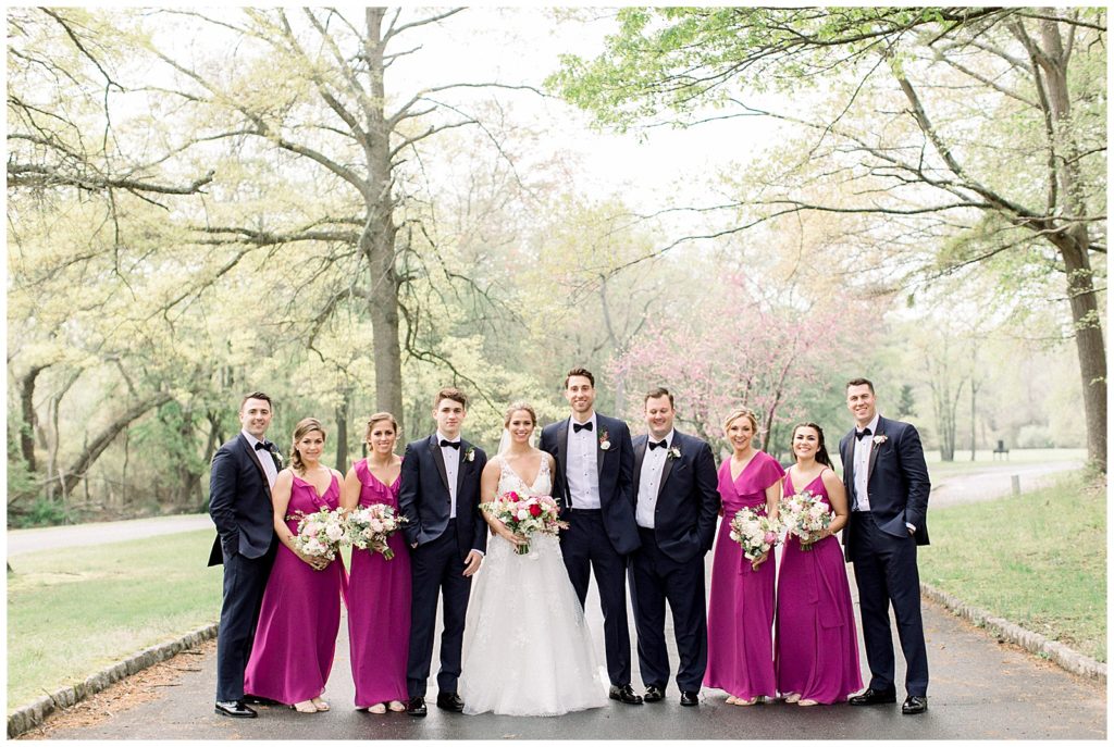classic and timeless pink bridal party with tuxedos