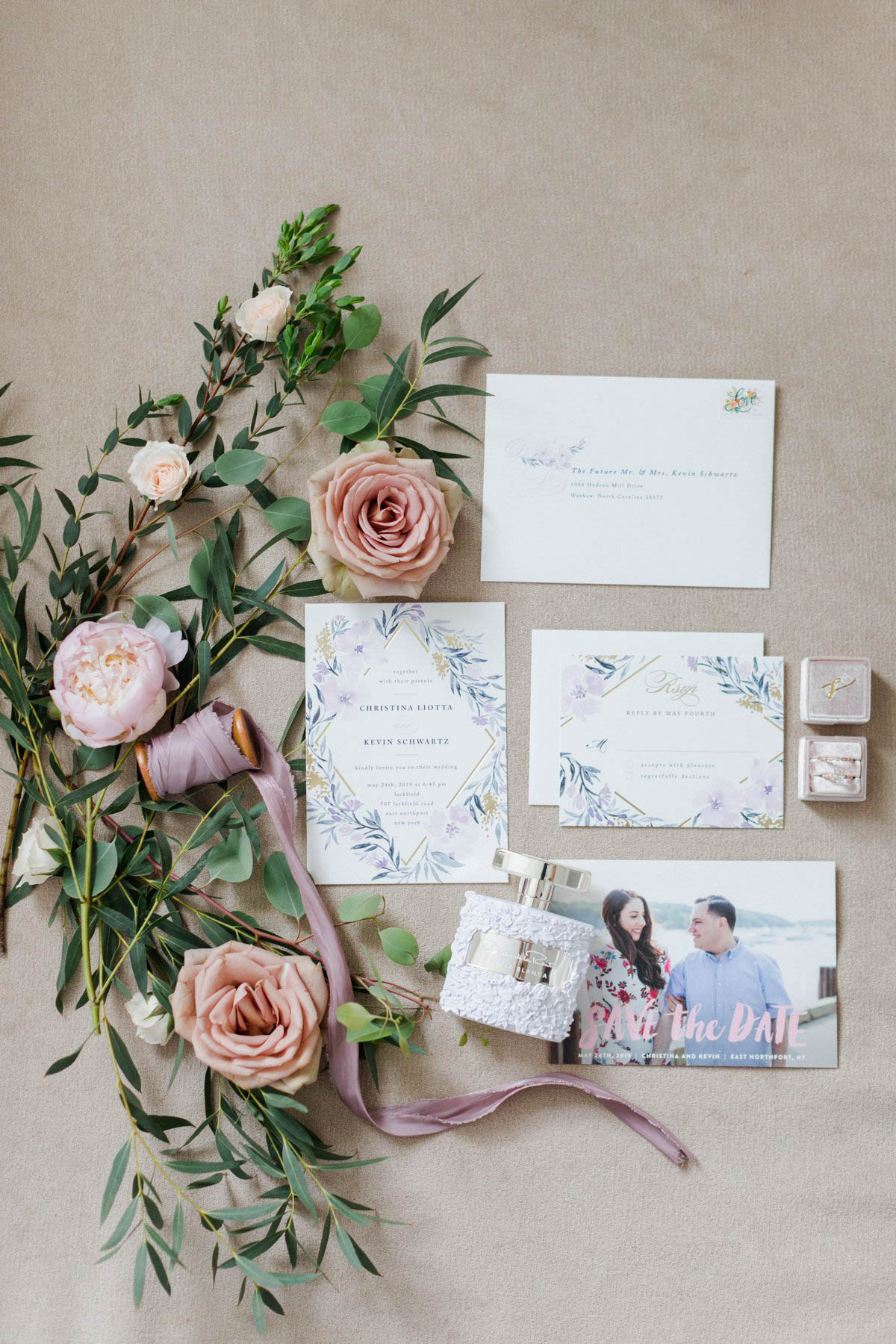 Wedding invitation suite surrounded by florals