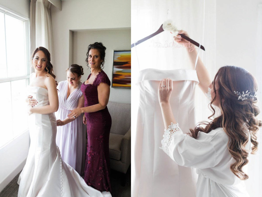 Mom and sister helping bride into the dress