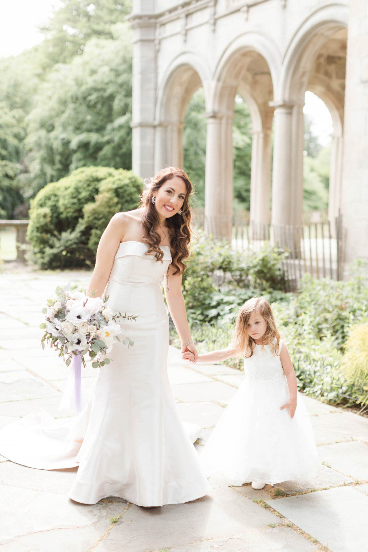 Flower girl and bride walking at Planting Fields