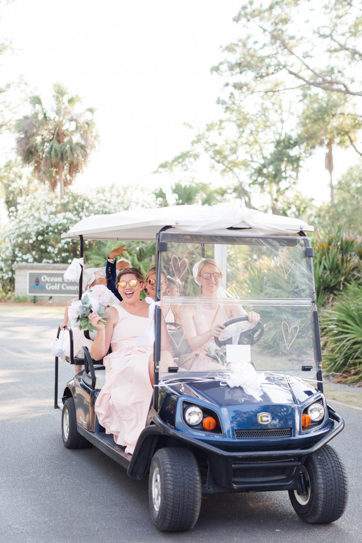 Wedding party ride golf cart throughout Fripp Island