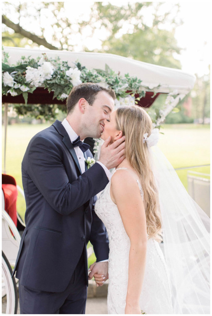groom kissing bride at the Lawrenceville school