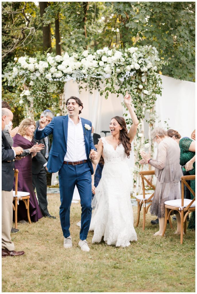 Bride and groom celebrate at their backyard wedding