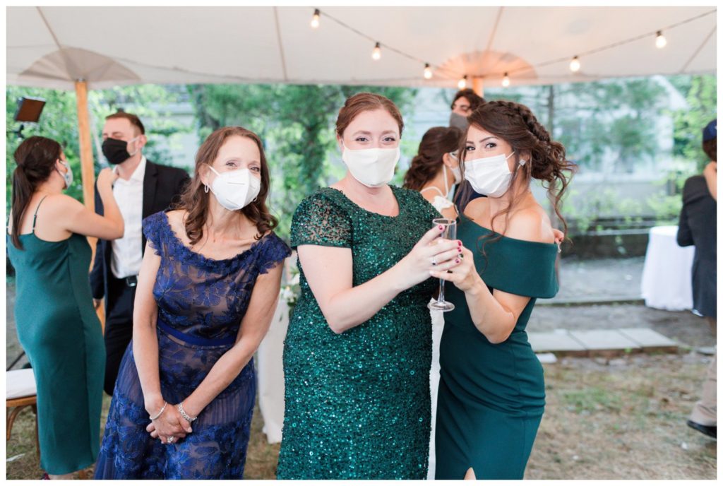 Masked wedding celebrate in the backyard