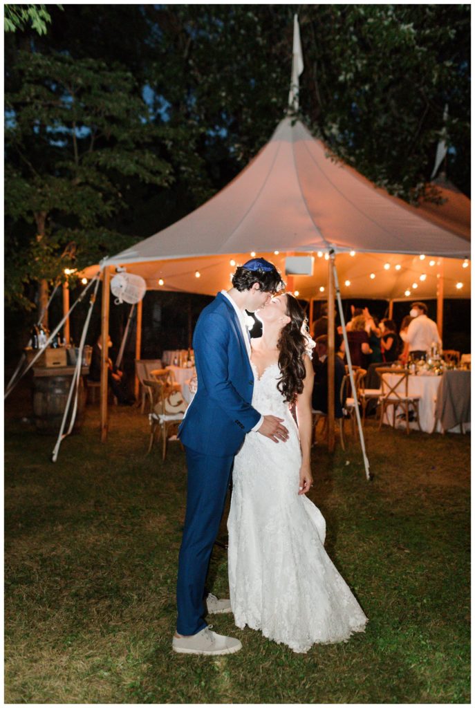 Night photo of bride and groom in their backyard at their home in New Jersey